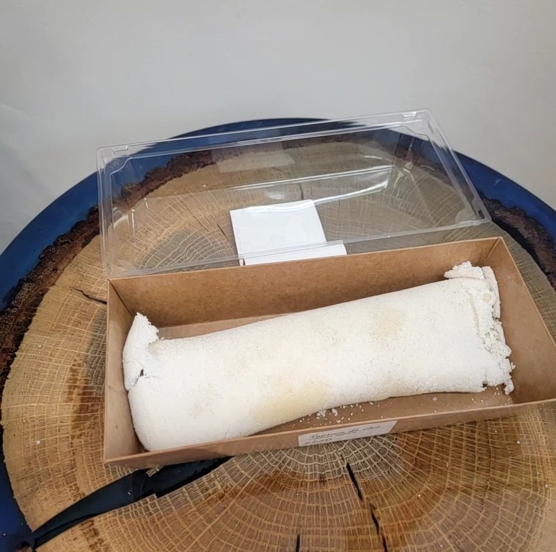 A coconut rocambole roll in a presentation box